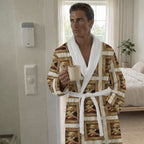 Man wearing a patterned robe holding a mug in a bedroom. Garment is a custom pet image design. 